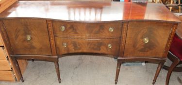 A reproduction mahogany dining table together with six chairs and a sideboard