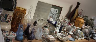 A glass decanter together with drinking glasses, a glass lemonade set, paperweights,