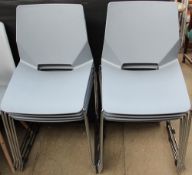 A set of eight grey plastic cafe chairs with chrome legs together with a pair of black metal stools