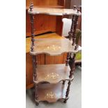 A Victorian inlaid walnut four tier whatnot with shaped shelves and turned uprights