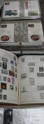 A stamp album together with first day covers and other stamps