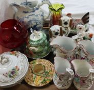 A set of four graduated pottery jugs, together with Staffordshire dogs, blue and white water jug,