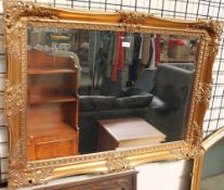 A rectangular gilt wall mirror together with a gilt overmantle mirror