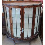 A 20th century walnut display cabinet