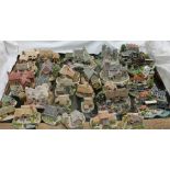 A collection of Lilliput Lane cottages and Danbury Mint Country Lines Collection models etc