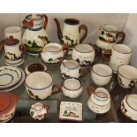 A collection of motto wares including mugs,