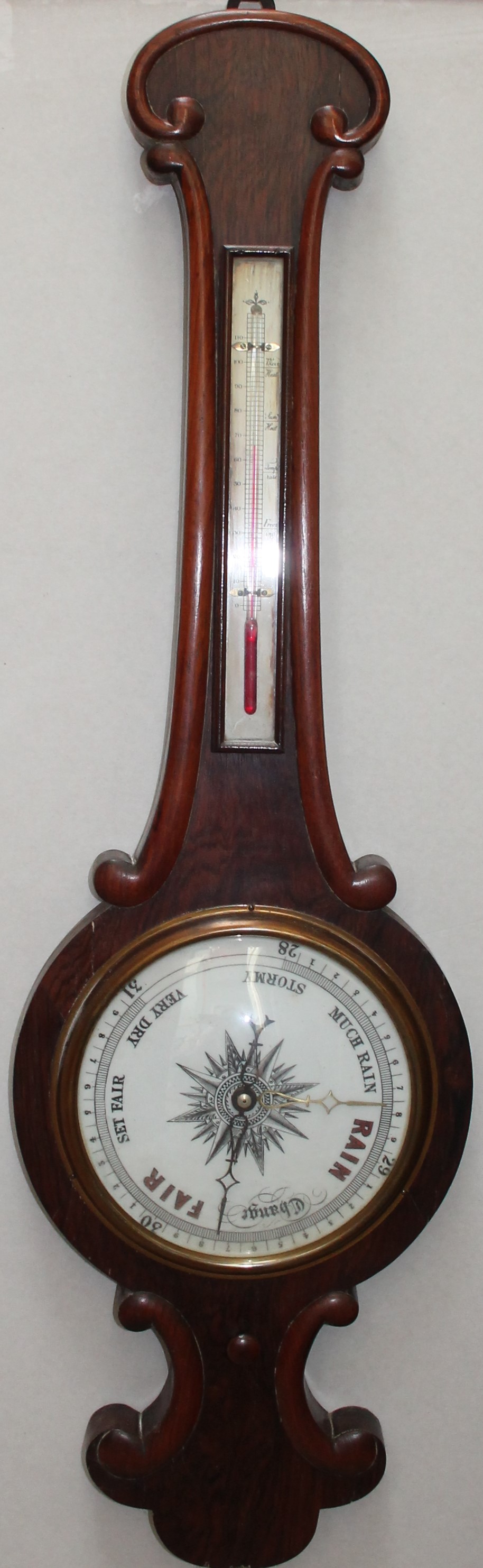 A Victorian rosewood banjo barometer together with an alcohol thermometer