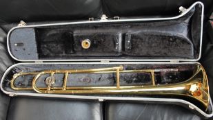 A Bundy trombone, cased, together with a Melody Maker trumpet, cased,