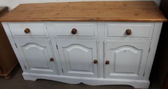 A painted pine dresser base together with a pine table