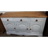 A painted pine dresser base together with a pine table