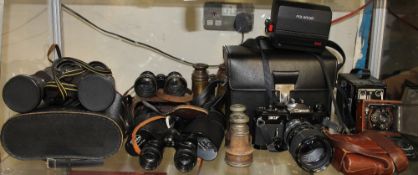 A Canon EF 35mm camera together with a Contessa folding camera, Conway camera, Polaroid camera,