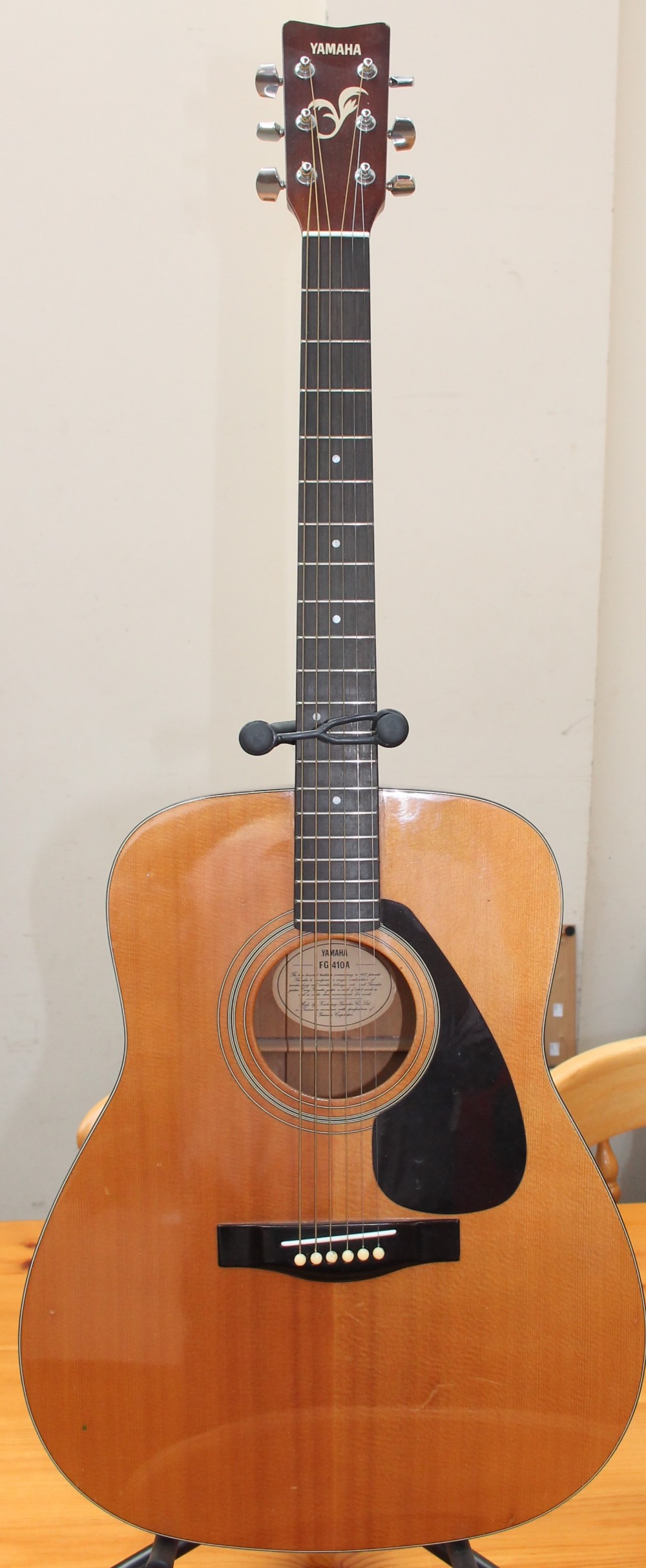 A Yamaha FG-410A acoustic guitar on a stand