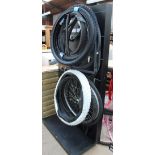 A display stand together with assorted bicycle tyres and wheels etc