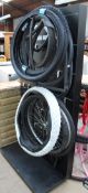A display stand together with assorted bicycle tyres and wheels etc