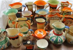 Assorted Myott & Son pottery jugs painted in oranges,