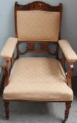 An Edwardian mahogany two seater settee on square tapering legs,