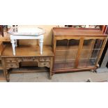 A mahogany display cabinet together with an oak dressing table,