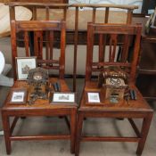 A pair of Ercol plate racks together with a pair of ball back chairs, prints,