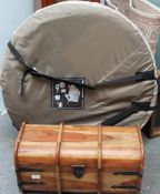A small hardwood trunk together with a quechaua pop up tent