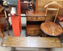 A 20th century oak bench together with an occasional table,