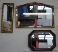 A large gilt wall mirror together with a smaller gilt wall mirror and a walnut framed wall mirror