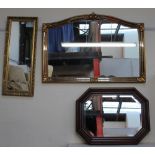 A large gilt wall mirror together with a smaller gilt wall mirror and a walnut framed wall mirror