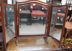 An Edwardian mahogany triptych dressing table mirror with brass vase finials