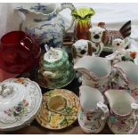 A set of four graduated pottery jugs, together with Staffordshire dogs, blue and white water jug,