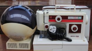 A JVC Videosphere television together with an electric sewing machine (Both sold as seen,