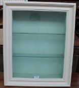 A white painted wall hanging cabinet