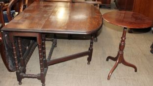 A 20th century oak gate leg dining table together with a wine table