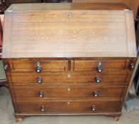 An 18th century oak bureau,