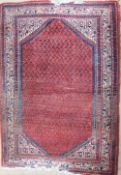 A red ground rug with a central medallion