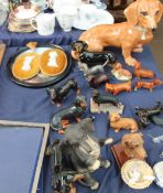 A Royal Doulton figure of a dachshund together with a collection of dachshund figures,