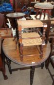 A 20th century oak gate leg dining table together with an oak stool, two rush seated stools,