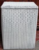 A Lloyd Loom laundry basket