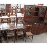 A 20th century oak extending dining table, dresser and four ladder back dining chairs,