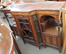 An Edwardian rosewood chiffonier base with a glazed central door and cupboards