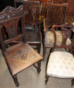 A George III oak dining chair together with a carved oak dining chair,