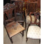 A George III oak dining chair together with a carved oak dining chair,