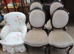A set of four ribbon carved upholstered dining chairs together with a floral upholstered chair