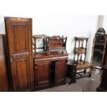 An oak wardrobe section together with a chiffonier base magazine rack, oak table/rack,