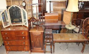 A 20th century chest of drawers together with a gilt decorated triptych mirror,