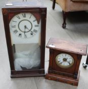 An oak mantle clock together with a wall clock