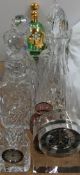 A Dartington clock together with glass decanters, glass bowls, green glass liqueur set,