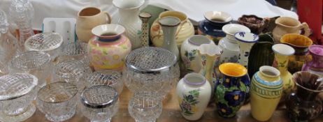 An Arthur Wood pottery jug together with other decorative jugs and vases,