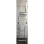 An aluminium ladder together with aluminium steps