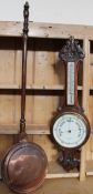 A oak cased aneroid barometer with a mercury thermometer together with a copper bed warming pan