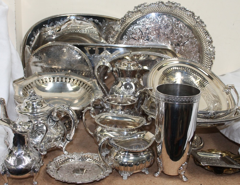 A four piece electroplated part tea service with electroplated trays,