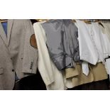 Assorted vintage clothes including suit jackets, waistcoats,